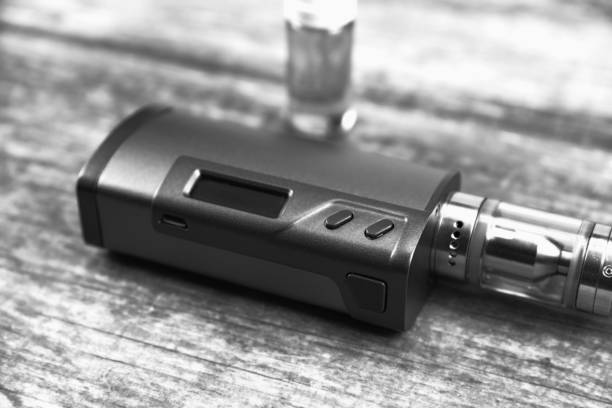 istock E - cigarette for vaping , technical devices.The liquid in the bottle 1052892238