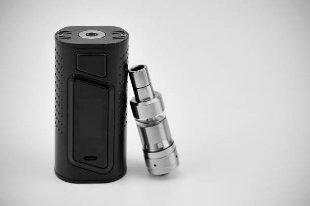 istock E - cigarette for vaping , technical devices.The liquid in the bottle 1052892346