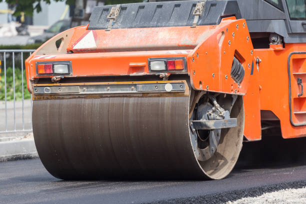 istock Heavy Vibration roller compactor at asphalt pavement works for road repairing 1052892616