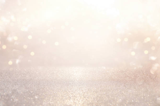 istock glitter vintage lights background. silver and light gold de-focused. 1052896936