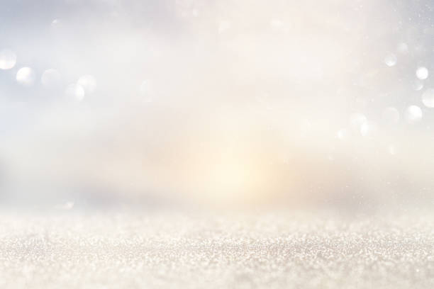 istock glitter vintage lights background. silver and light gold de-focused. 1052896968