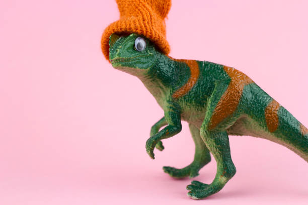 Latin toddler playing with a dinosaur toy