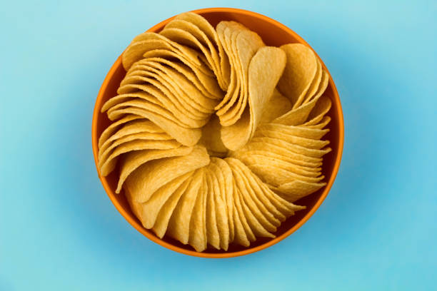 istock top view  orange bowl full of potato chips 1052898892