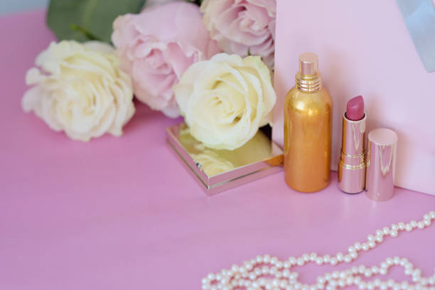 istock Perfume, gift, pearls, gentle roses on a pink background. 1052904760