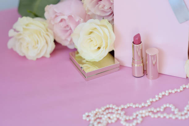 istock Perfume, gift, pearls, gentle roses on a pink background. 1052904764