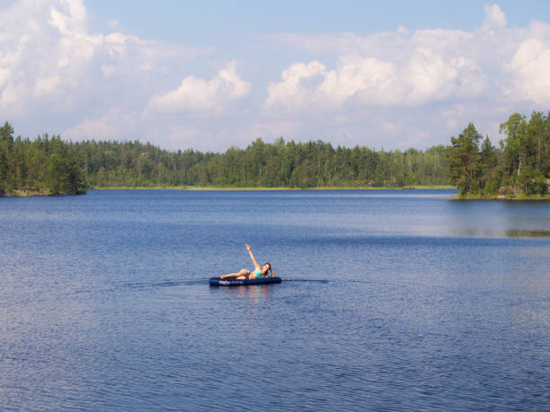 istock girl on a forest lake 1052910394