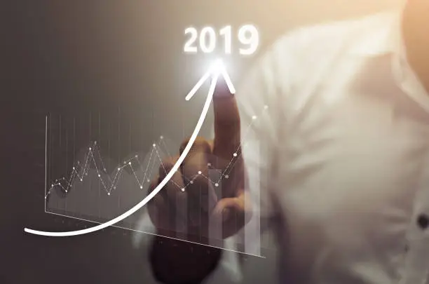 Businessman plan growth and increase of positive indicators in his business. Business growth concept year 2019