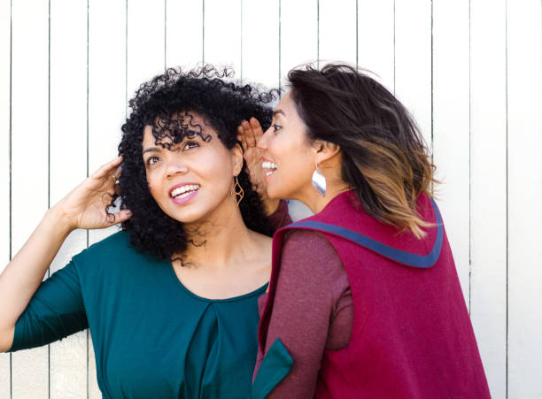 istock Two best friends telling each other a secret 1052914368