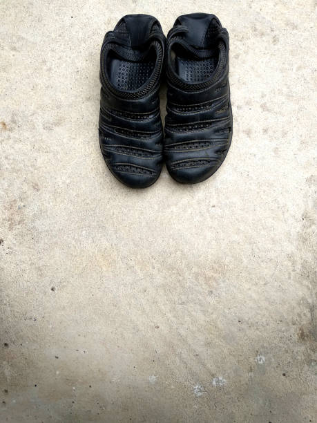 istock Black rubber sandals isolated on the white concrete background with shadow. 1052917614
