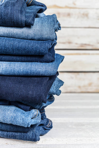 istock Jeans on wooden background 1052922790