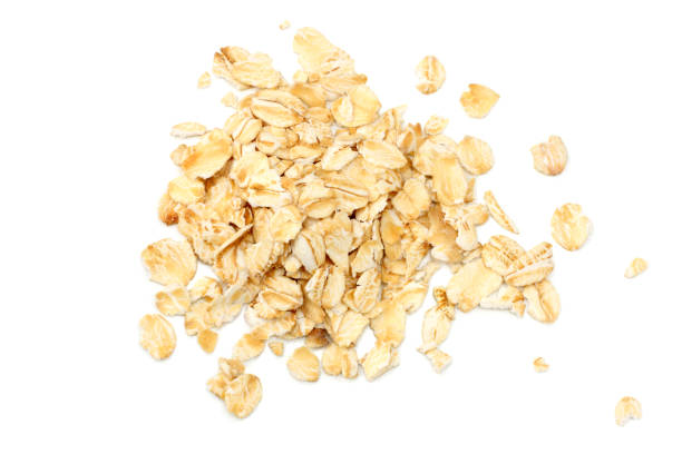 istock oatmeal isolated on white background. top view 1052929454