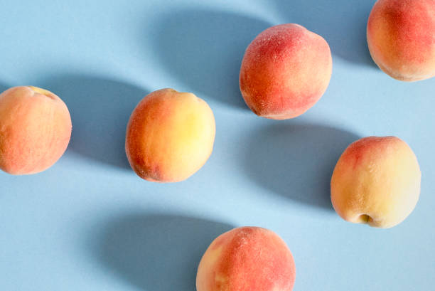 istock Whole ripe beautiful peaches with shadows 1052943952