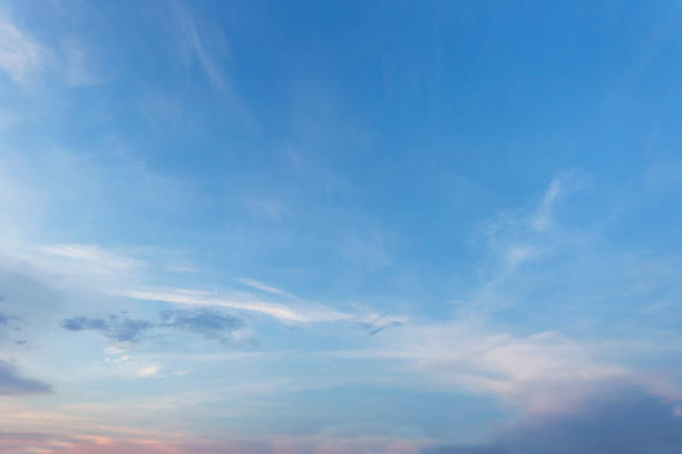 istock The vast sky and the white clouds float in the sky. The natural blue background has a breeze on a bright day in the summer.The sky and clouds are not the same shape as the weather. 1052951680