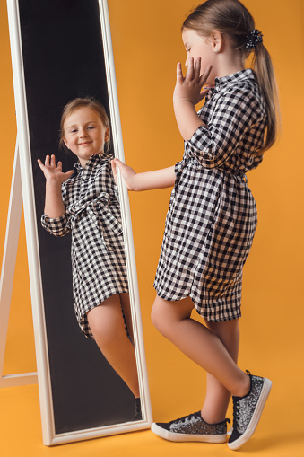 child in the Studio posing in fashionable clothes