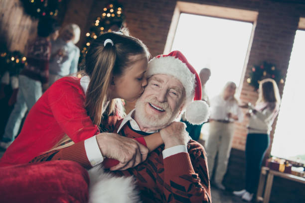best tradition happiness fairy december 2019 concept. close up photo portrait of small little cute lovely dreamy charming girl kissing in cheer her kind bearded granddad decorated room christmastime - senior adult winter senior women daughter imagens e fotografias de stock