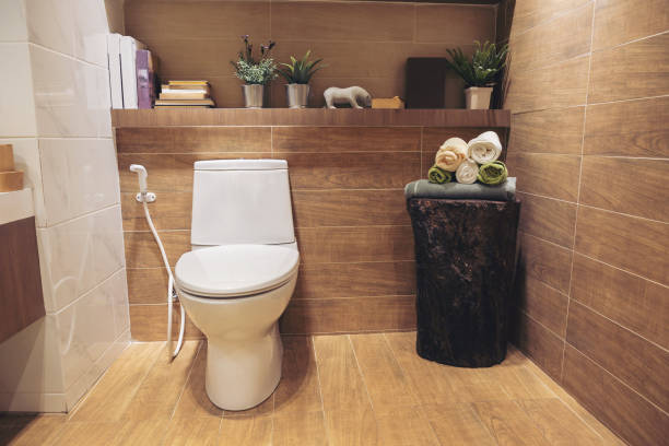 istock Modern spacious bathroom with bright tiles with toilet and sink. 1052952224