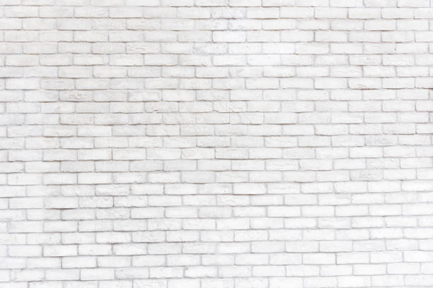 istock Abstract weathered texture stained old stucco light gray and aged paint white brick wall background in rural room, grungy rusty blocks of stonework technology color horizontal architecture wallpaper 1052952464