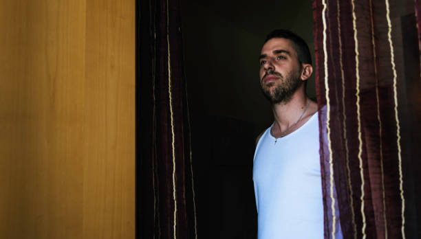 istock Attractive young man with beard seen from below 1052962880