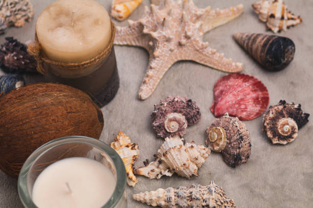 istock Christmas accessories, candles and seashells on a gray background 1052965276