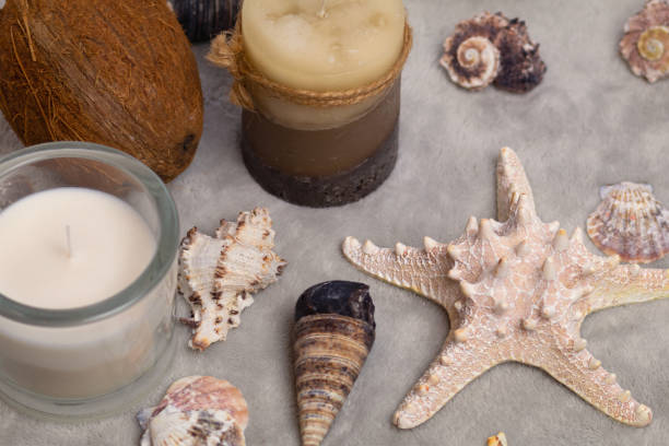 istock Christmas accessories, candles and seashells on a gray background 1052965346