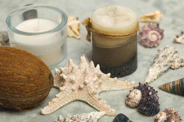 istock Candles and seashells on a gray background 1052965460