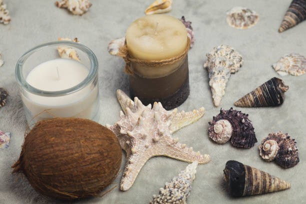 istock Christmas accessories, candles and seashells on a gray background 1052965554