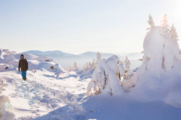 istock Man in the forest, winter day 1052966702