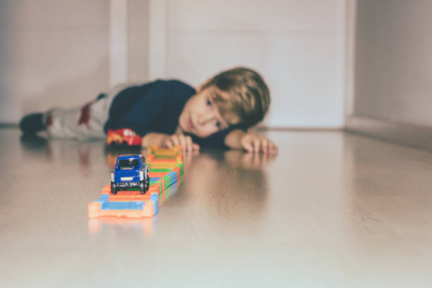 istock Small boy enjoying in playtime at home. 1052967028
