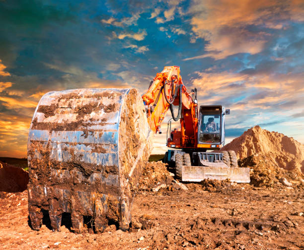 istock Excavator bucket. Huge excavator in the evening. 1052967330
