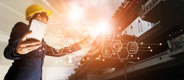 istock A futuristic architect, Businessman, Industry 4.0. Engineer manager using  mobile smartphone with icon network connection in construction site, Industrial and innovation. Industry technology concept. 1052976686