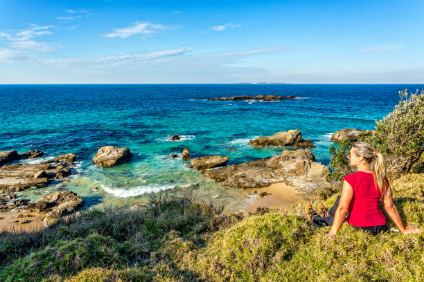 istock Relaxing on grassy headland with beautiful coastal views 1052985866