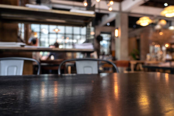 istock Vintage wooden table and chairs in loft cafe 1052991548