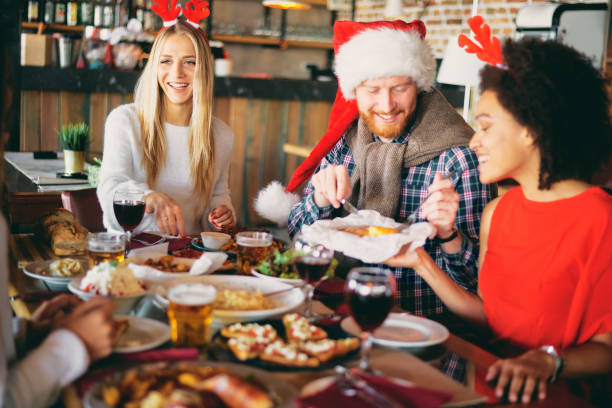 istock Friends having dinner at home at Christmas eve. 1052993908