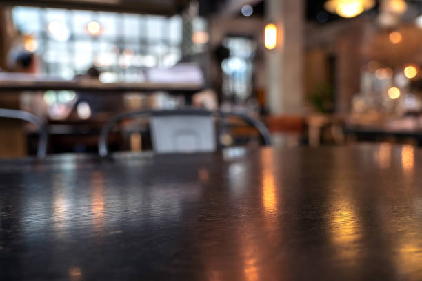 istock Vintage wooden table and chairs in loft cafe 1052993944