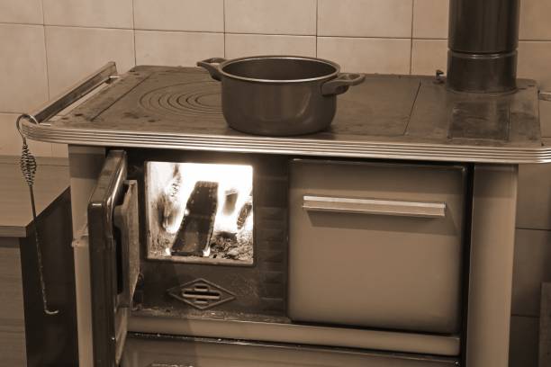 istock wood stove with fire in the kitchen with sepia effect 1052994464