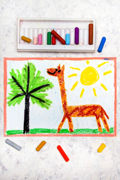 istock Colorful hand drawing: cute smiling giraffe with long neck 1052995110
