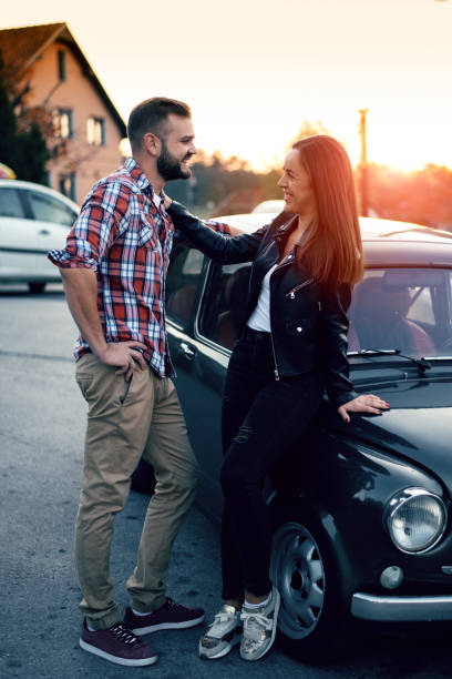 istock Couple hugging by car at sunset 1052995958