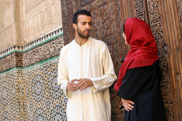 istock Arab couple talking on the street 1052997232