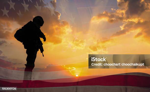 Double Exposure Silhouette Of Soldier On The United States Flag In Sunset For Veterans Day Is An Official Usa Public Holiday Background Copy Space Stock Photo - Download Image Now