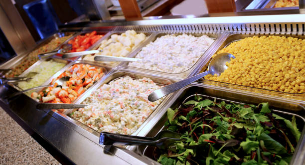 istock self service restaurant with many trays filled with lettuce corn 1053009990