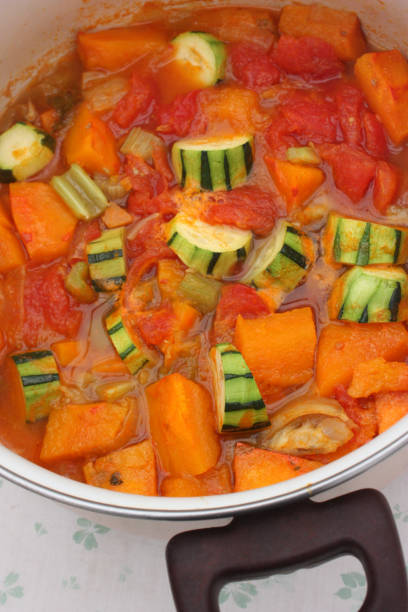 istock Cooking a pumpkin soup with various vegetables 1053010126