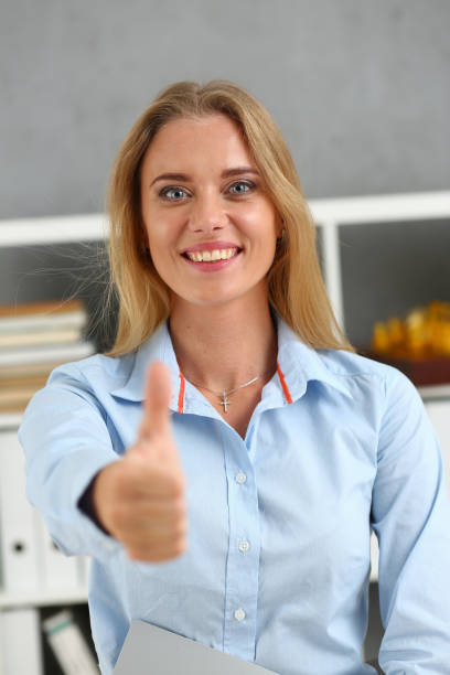 istock Female arm show OK or approval with thumb up 1053013912