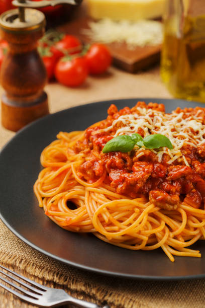 istock Delicious spaghetti served on a black plate 1053015276
