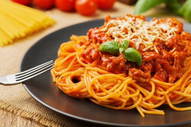 istock Delicious spaghetti served on a black plate 1053016932
