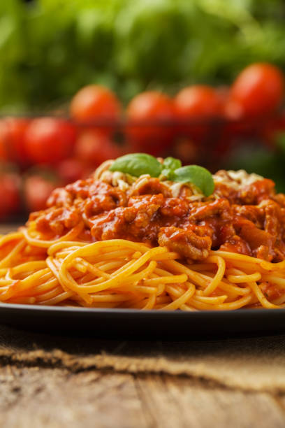 istock Delicious spaghetti served on a black plate 1053017260