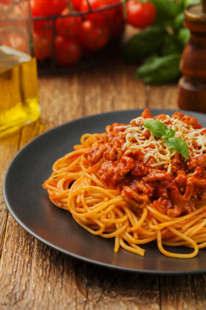 istock Delicious spaghetti served on a black plate 1053017468