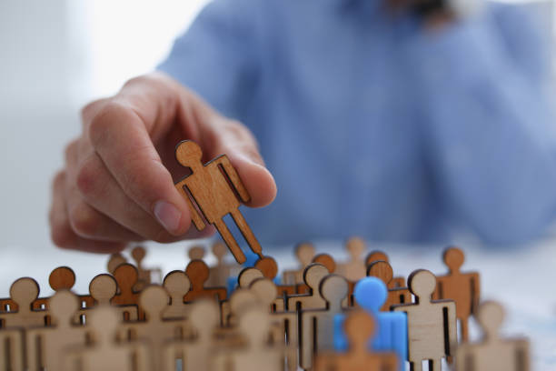 istock A businessman in blue shirt is holding a magnifying 1053017858