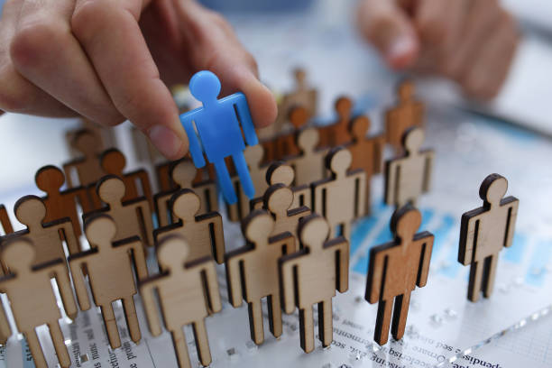 istock A businessman in blue shirt is holding a magnifying 1053017876