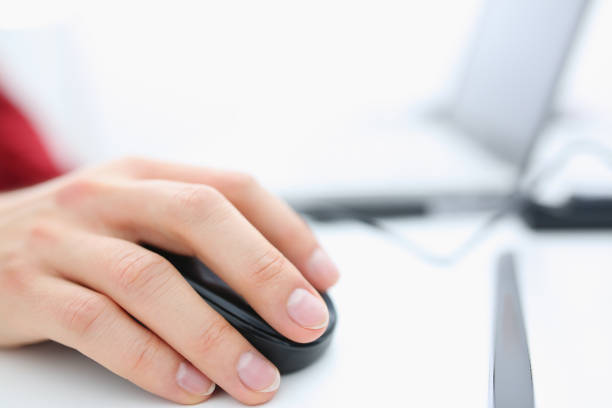 istock Male hand used computer mose holding in arm 1053018128