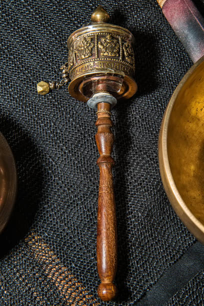 istock Hand prayer wheel and Tibetan Singing bowls 1053020550